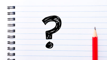 Question Mark Text written on notebook page, red pencil on the rightの写真素材