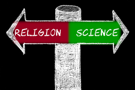 Opposite arrows with Religion versus Science.
Hand drawing with chalk on blackboardの写真素材