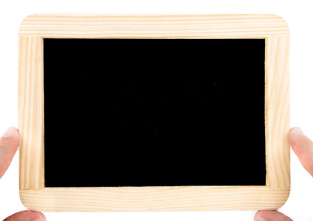 Close up on pair of hands holding a wooden frame chalkboard isolated on white, imperfect black...