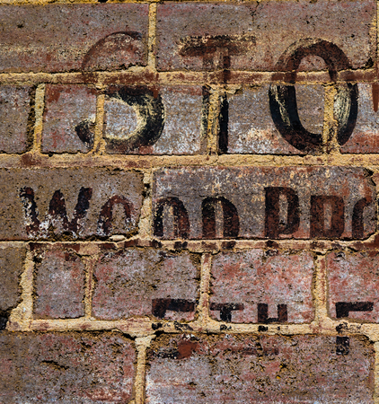 Vintage writing on brick wallの写真素材