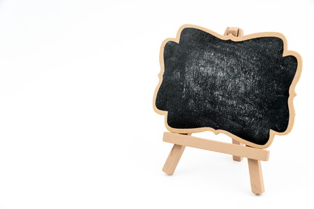 Wooden easel mini blackboard with faded chalk surface, right hand side view, isolated on white, copy space availableの写真素材