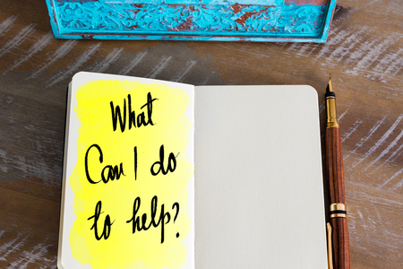 Question What Can I Do To Help ? handwritten on notebookの写真素材