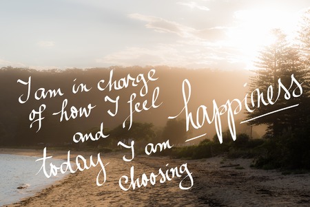 Today I Am Choosing Happiness message. Handwritten motivational text over sunset calm sunny beach background with vintage filter appliedの写真素材