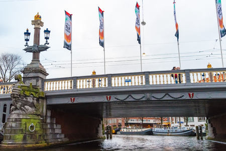 Amsterdam, Netherlands - January 9, 2017: Street view with traditional Dutch row houses and famous canals in Amsterdam historical city center, the Netherlands' capital, known for its artistic heritageのeditorial素材