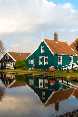 Zaanse Schans, Netherlands - January 10, 2017: Rural Dutch scenery with water canals in Zaanse Schans village known for well-preserved historic windmills and row houses near Amsterdam, Netherlands.のeditorial素材