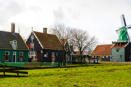 Zaanse Schans, Netherlands - January 10, 2017: Rural Dutch scenery with water canals in Zaanse Schans village known for well-preserved historic windmills and row houses near Amsterdam, Netherlands.のeditorial素材