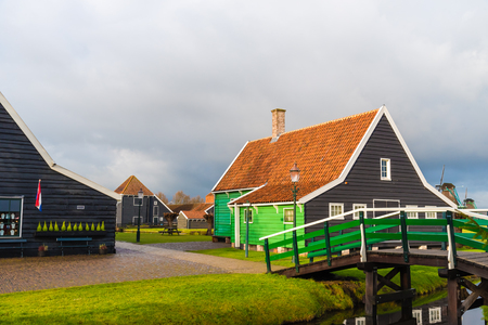 Zaanse Schans, Netherlands - January 10, 2017: Rural Dutch scenery with water canals in Zaanse Schans village known for well-preserved historic windmills and row houses near Amsterdam, Netherlands.のeditorial素材