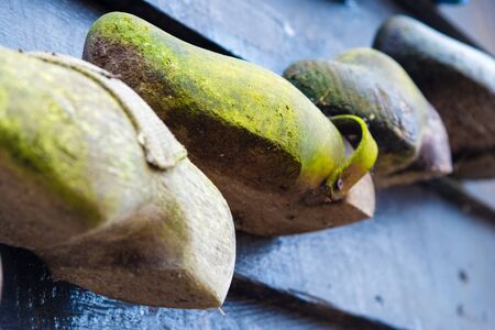 Zaanse Schans, Netherlands - January 10, 2017: Traditional handmade Dutch wooden shoes in Zaanse Schans village near Amsterdam, Netherlands. Klompen are whole feet clogs made of willow or poplar.のeditorial素材