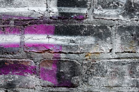 Brickwall vintage grunge background and graffiti sprayの写真素材