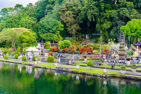 Bali, Indonesia - May 3, 2017 : Tirta Gangga, the former royal water palace is a maze of pools and fountains surrounded by a lush garden and stone carvings and statues near Karangasem, Bali, Indonesiaのeditorial素材
