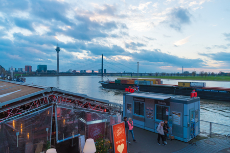 Dusseldorf, Germany - November 27, 2017 : Street view of river Rhine in old city Altstadt. Dusseldorf is an international business and financial centre, renowned for its fashion and trade fairs.のeditorial素材
