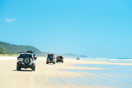 Rainbow Beach, QLD, Australia- December 30, 2017: 4wd vehicles at Rainbow Beach, a popular tourist destination and a gateway to Fraser Island, its name derives from the rainbow-coloured sand dunes.のeditorial素材