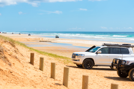 Rainbow Beach, QLD, Australia- December 30, 2017: 4wd vehicles at Rainbow Beach, a popular tourist destination and a gateway to Fraser Island, its name derives from the rainbow-coloured sand dunes.のeditorial素材