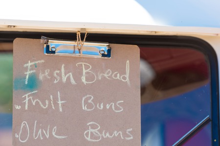 Fresh bread sign written by hand at farmers marketの写真素材