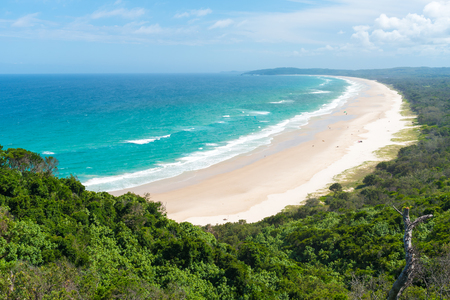 View over Tallow Beach with turquoise waters in Arakwai National Park at Byron Bay, NSW, Australia.の写真素材