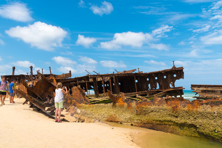 Fraser Island, QLD, Australia - December 31, 2017: People at the Maheno shipwreck on 75 mile beach, one of the most popular landmarks on Fraser Island, Fraser Coast, Queensland, Australia.のeditorial素材