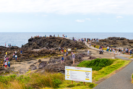 Kiama, NSW, Australia-March 31, 2018: View over coastline, water waves and rocky shore in Kiama,...