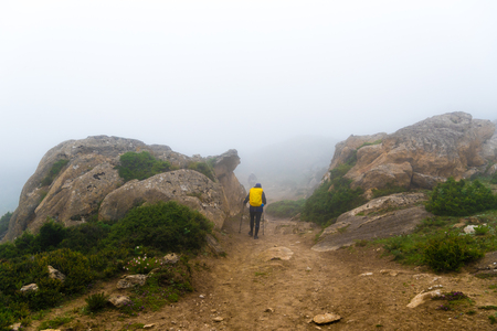 Annapurna Conservation Area, Nepal - July 21, 2018 : Backpackers on foggy trekking path in Annapurna Conservation Area, Nepal, a hotspot destination for trekkers and Nepal's largest protected areaのeditorial素材