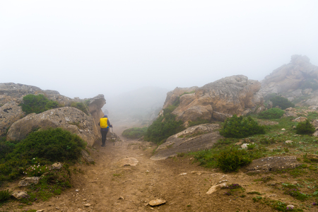 Annapurna Conservation Area, Nepal - July 21, 2018 : Backpackers on foggy trekking path in Annapurna Conservation Area, Nepal, a hotspot destination for trekkers and Nepal's largest protected areaのeditorial素材