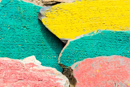 Nar village, Annapurna Conservation Area, Nepal - July 22, 2018 : Ancient buddhist carved stones with sacred religious mantras in Nar Village, Annapurna Conservation Area, Nepalのeditorial素材