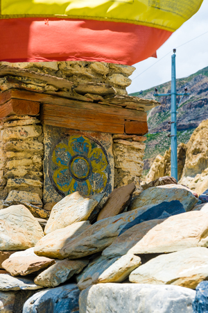 Nar village, Annapurna Conservation Area, Nepal - July 24, 2018 : Ancient buddhist carved stones with sacred religious mantras in Manang Village, Annapurna Conservation Area, Nepalのeditorial素材