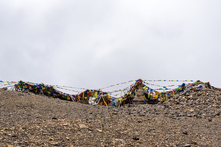 Annapurna Conservation Area, Nepal - July 28, 2018 : Prayer flags on Thorang-la pass, Annapurna Circuit, Annapurna Conservation Area, the largest protected area of Nepalのeditorial素材