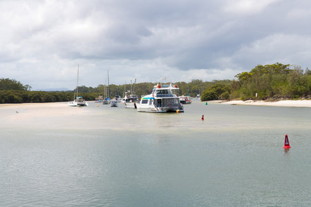 Huskisson, NSW, Australia-December 22, 2018: View over bay of water and boats from the public wharf in the city of Huskisson, Australia, a small coastal town well known as gateway to Jervis Bay areaのeditorial素材