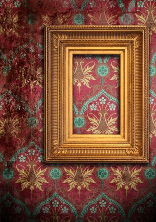 Gold frame on the old red grunge wallpaperの写真素材