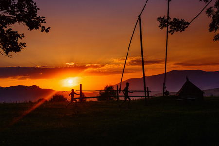 silhouette people on sunsetの写真素材