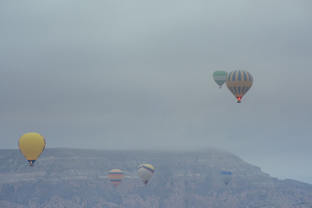 Balloon foggy morning in Cappadociaの写真素材