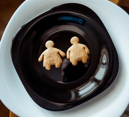 Pile of  cookies on a black plateの写真素材