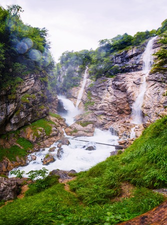 mountain waterfall in alpsの写真素材