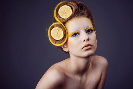 woman with fruit in hairの写真素材