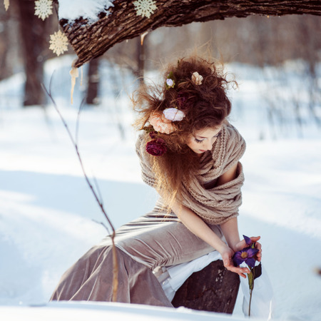 beautiful girl in the winter forestの写真素材