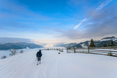 tourist in winter in the mountainsの写真素材