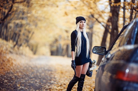 Sexy blonde girl with weaponの写真素材