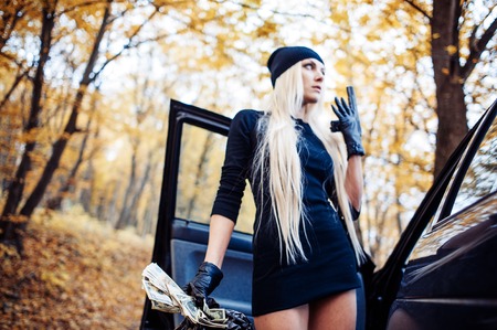 Sexy blonde girl with weaponの写真素材