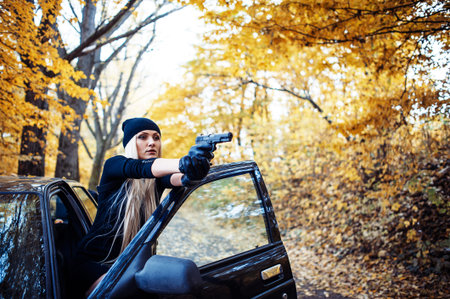Sexy blonde girl with weapon