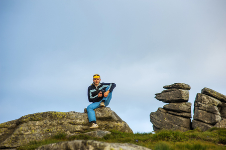 tourist on a rockの写真素材