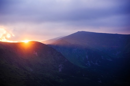 beautiful sunset in the mountainsの写真素材