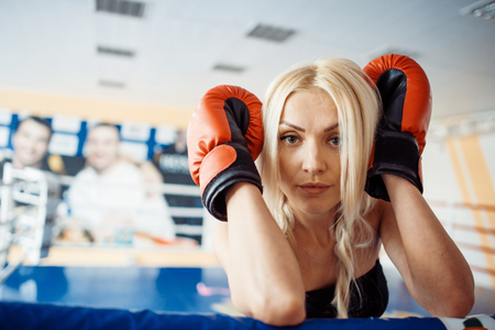 Pretty sport woman with boxing glovesの写真素材