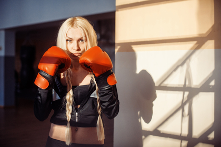Pretty sport woman with boxing glovesの写真素材