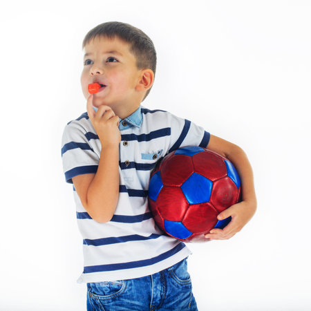 little boy footballer isolated