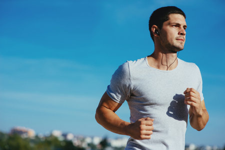 Attractive strong athlete running