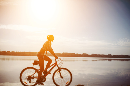 woman on a bicycle in  beachの写真素材