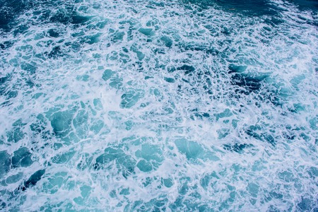 Background blue waves of the seaの写真素材