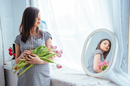 pregnant woman with flowersの写真素材