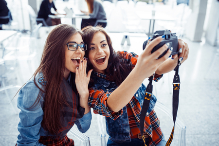 Happy girl with tourists photo of yourself. Art processing and rの写真素材