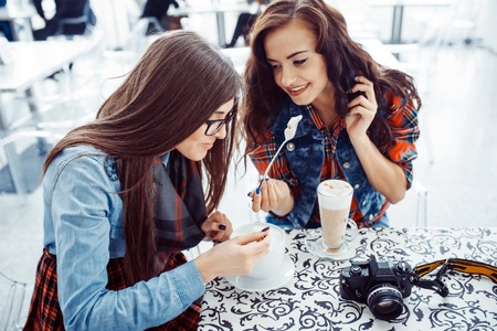 Girl drink coffee latte.Art processing and retouching photos speの写真素材
