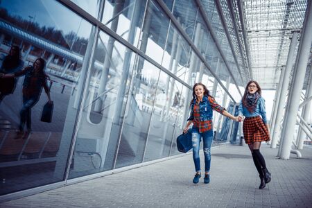 Girls having fun and happy when they met at the airport.Art proc Girls having fun and happy when they met at the airport.Art proc